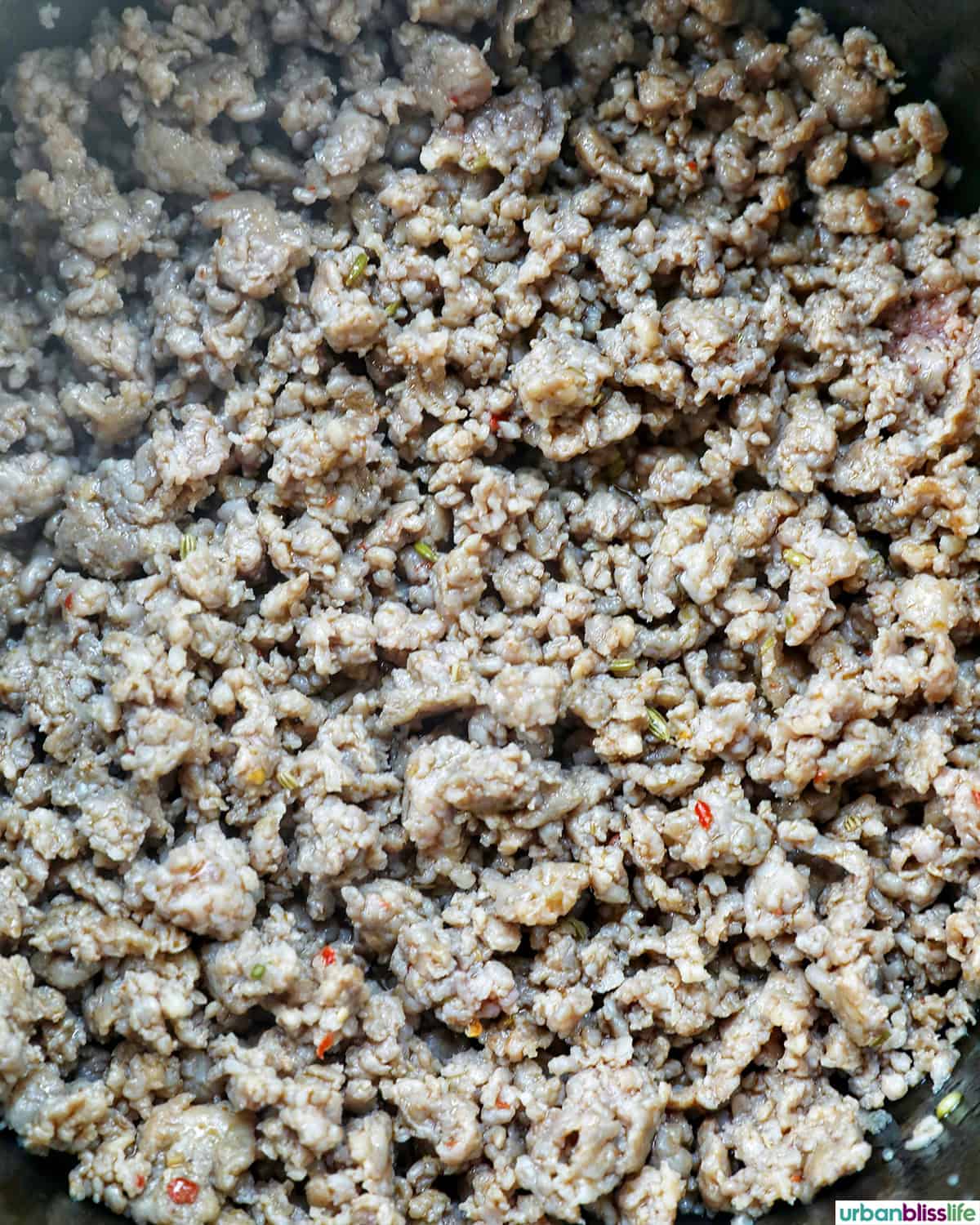 sausage cooking in a pot.