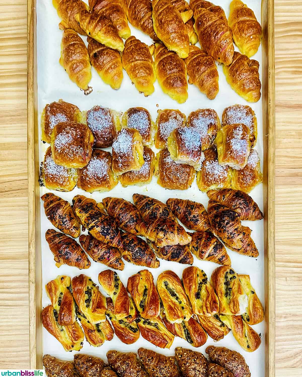 tray of croissants and other French pastries.