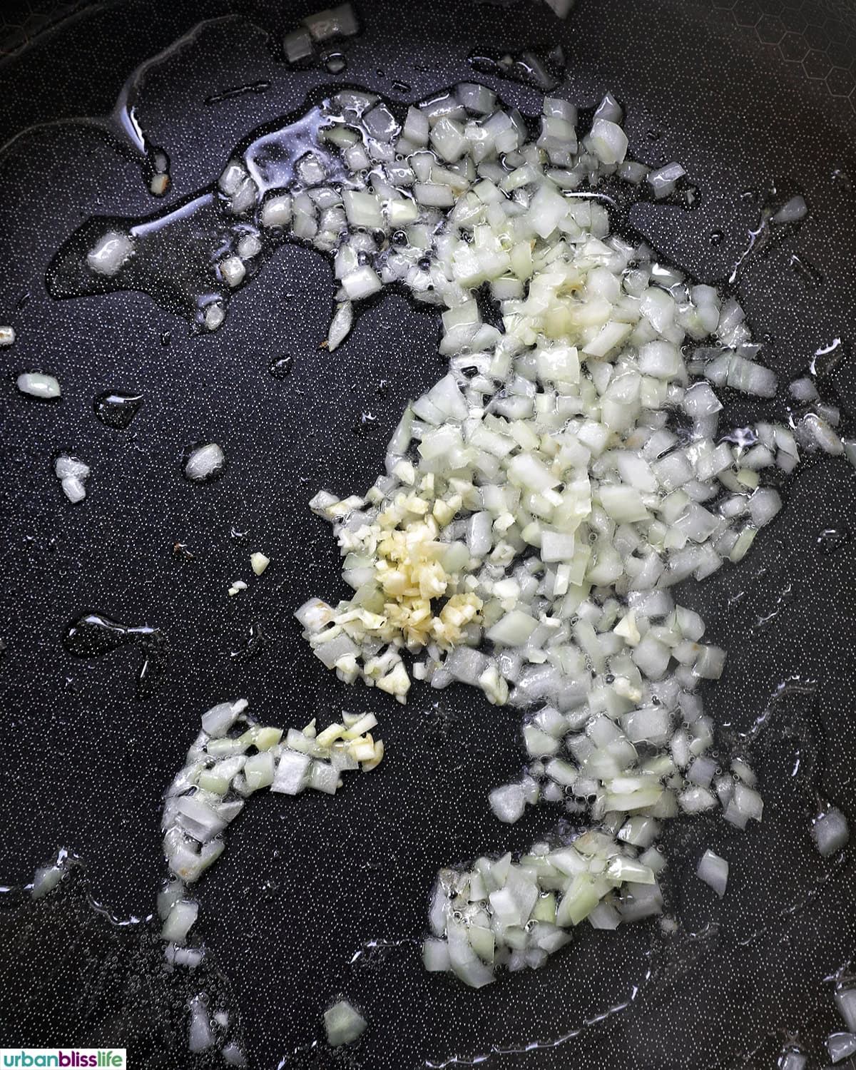 onions and garlic in a pan.