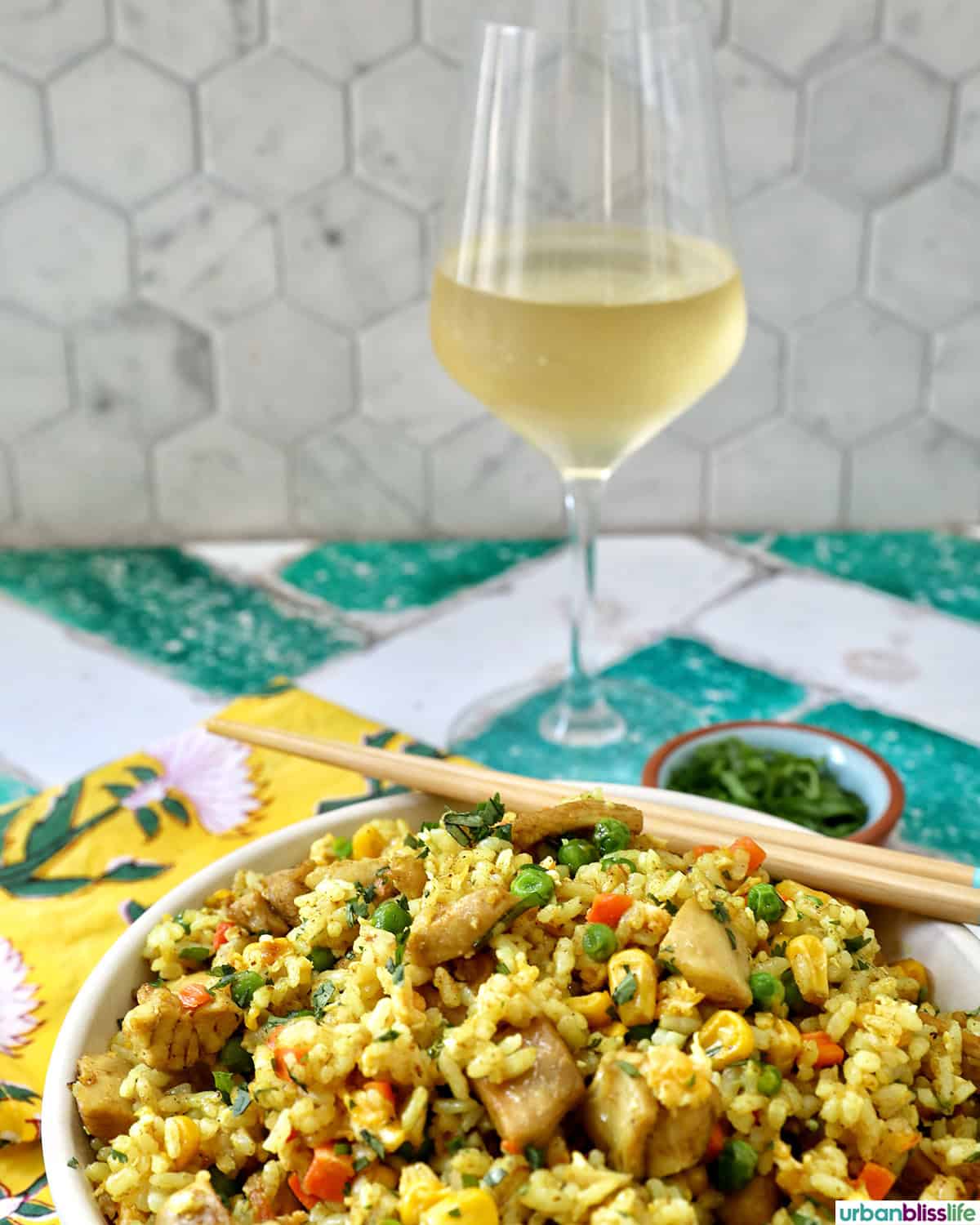 curry chicken fried rice with a glass of white wine.