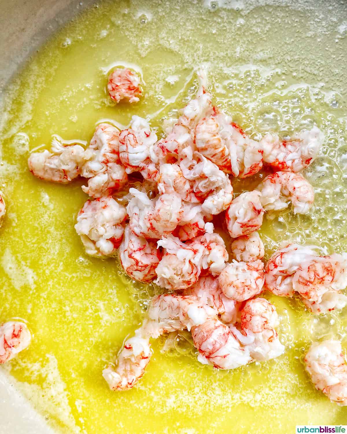 lobster meat cooking in butter.