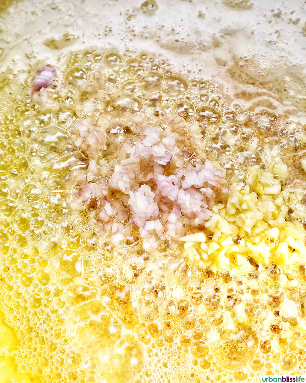 shallots and garlic in butter in a pan.