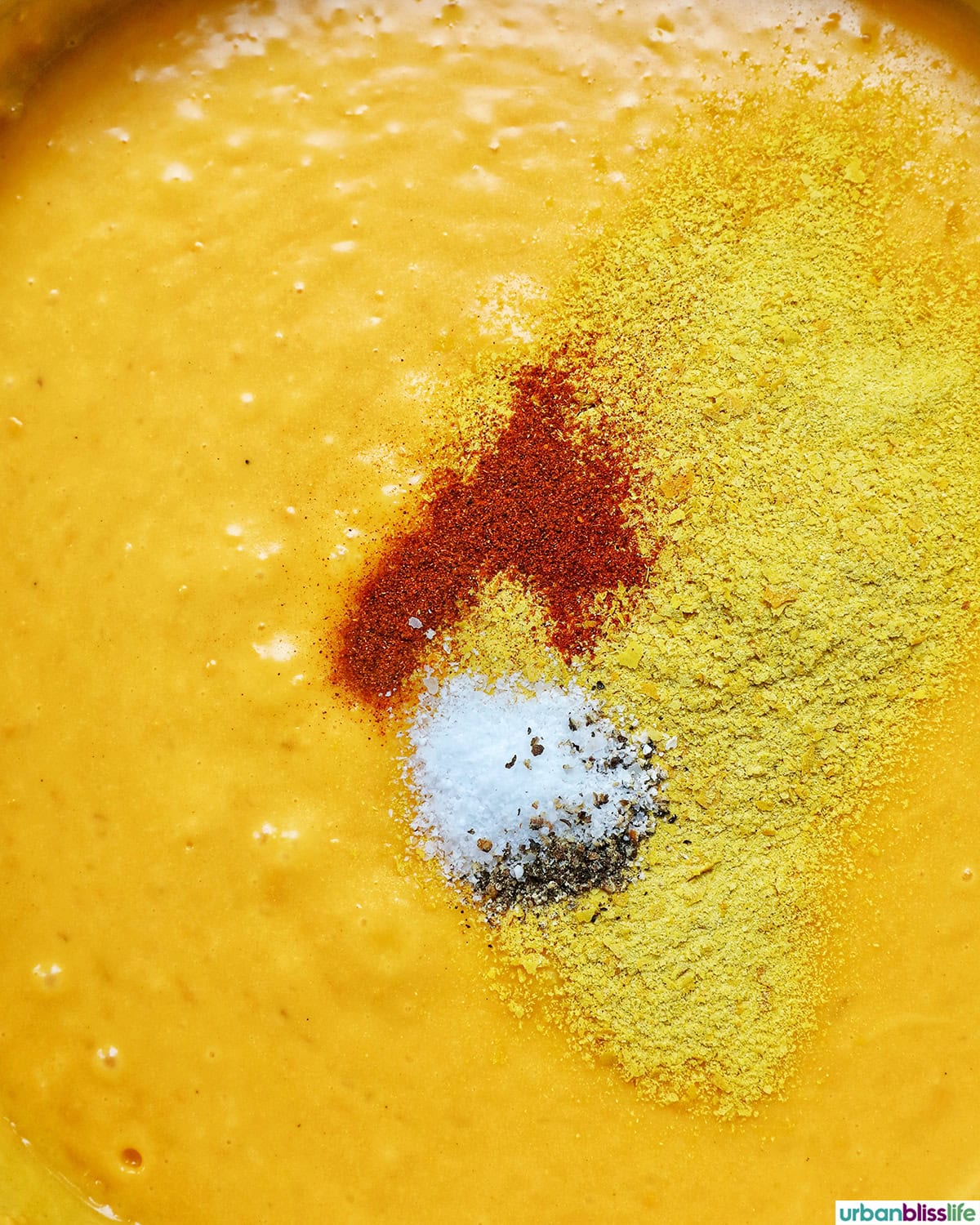 spices and melted cheese in a pan.