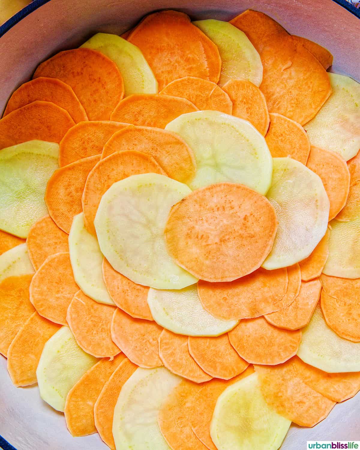 layers of sweet potatoes to make sweet potato gratin.