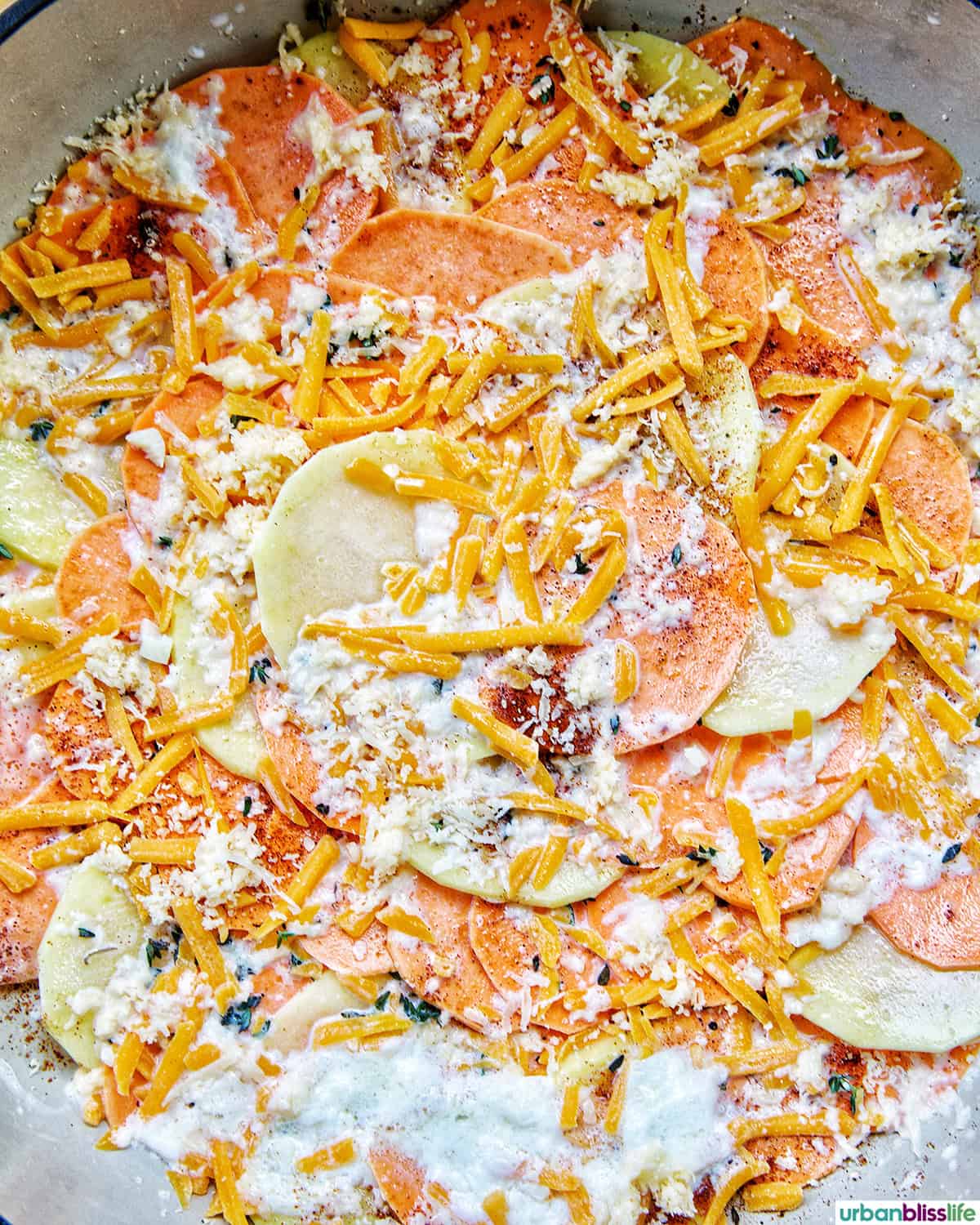 sweet potato gratin cooking in a pan.