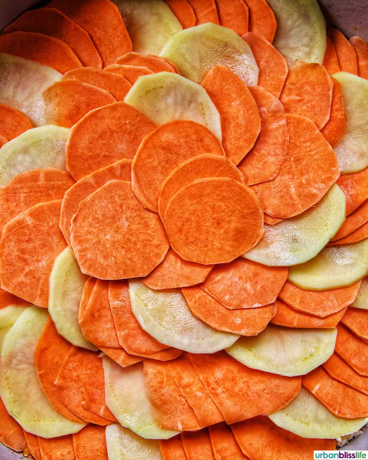 layers of sweet potatoes to make sweet potato gratin.