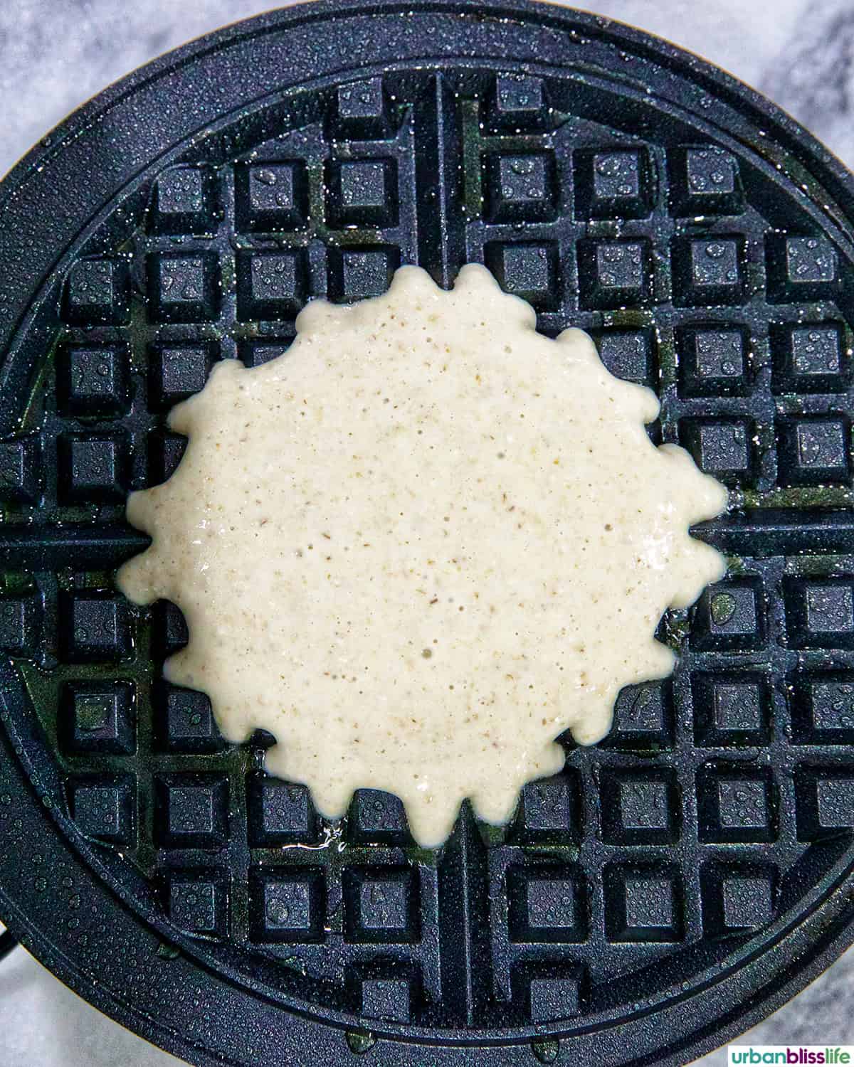 cottage cheese waffle batter on a waffle iron.