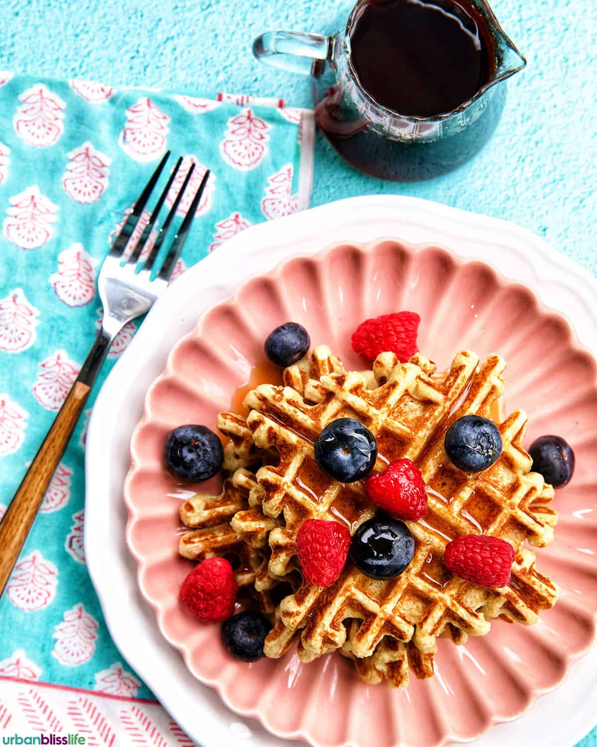 cottage cheese waffles with berries and syrup.