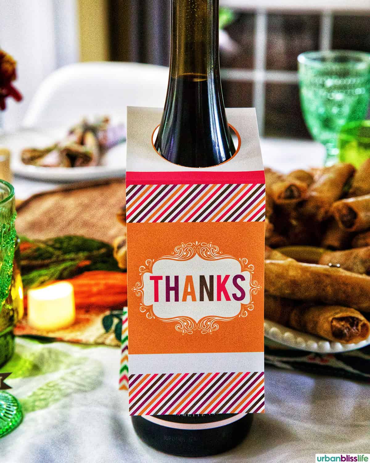 bottle of wine with "thanks" label over it.