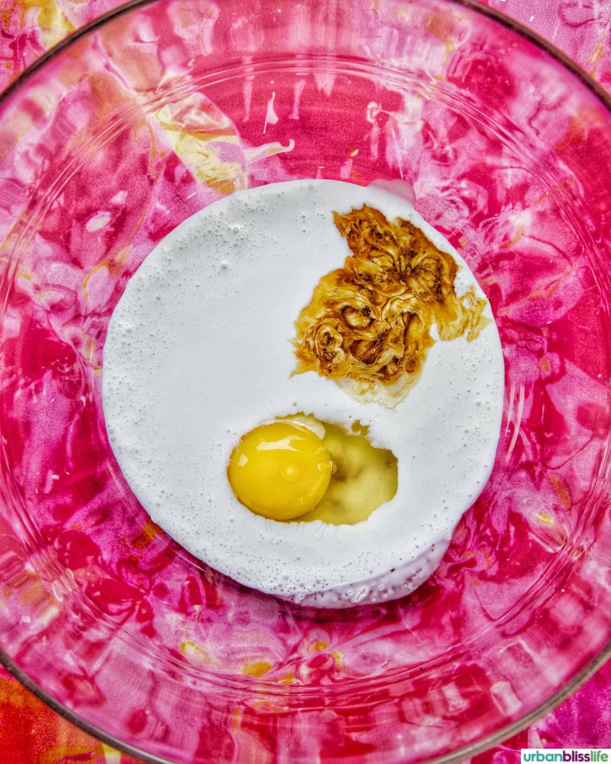 cream, egg, and vanilla in a bowl.