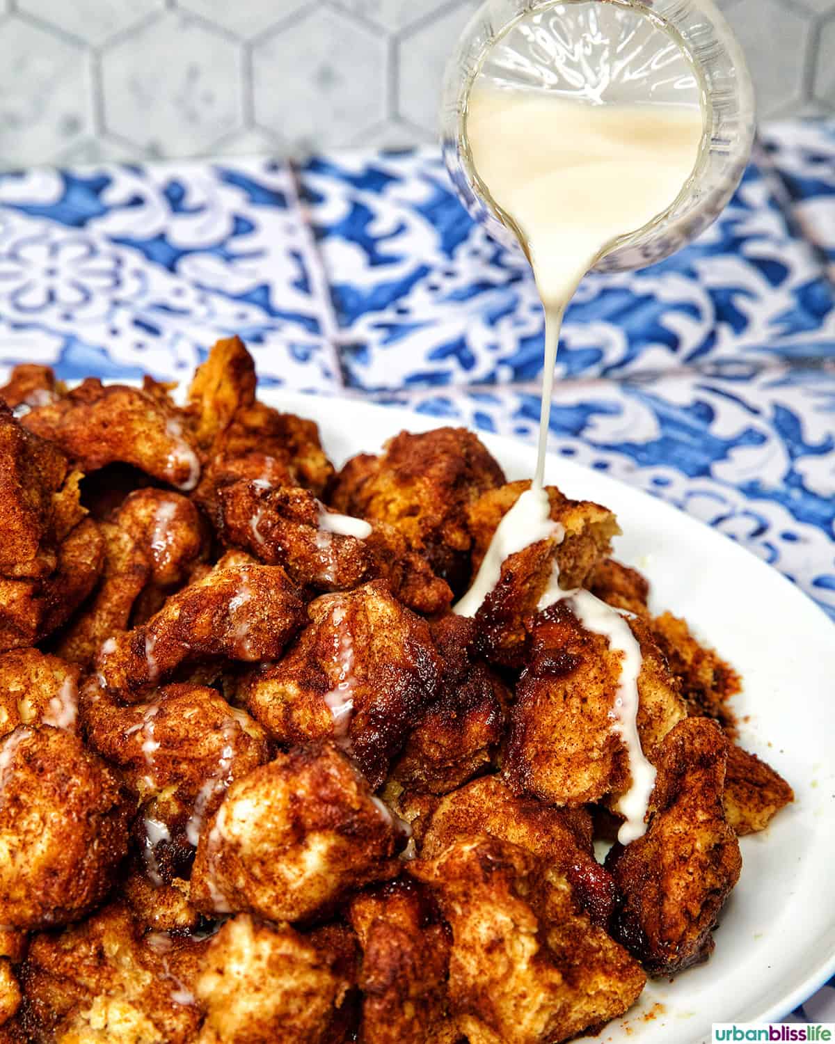pouring icing over monkey bread.