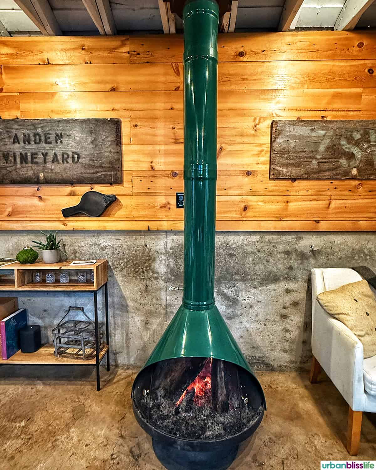 green fireplace at Evening Land Vineyards wine tasting cabin.