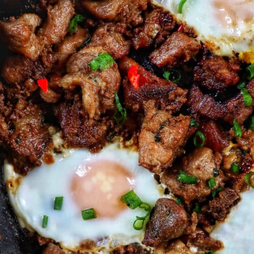 Filipino pork sisig with fried egg on top.