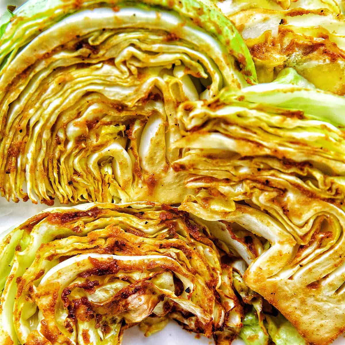 air fryer Asian cabbage steaks on a plate.