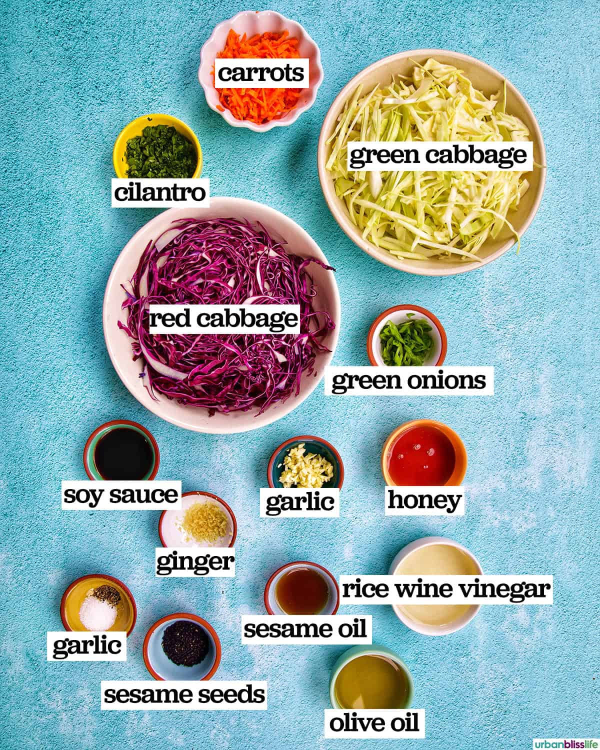 bowls of ingredients to make Asian cabbage coleslaw.