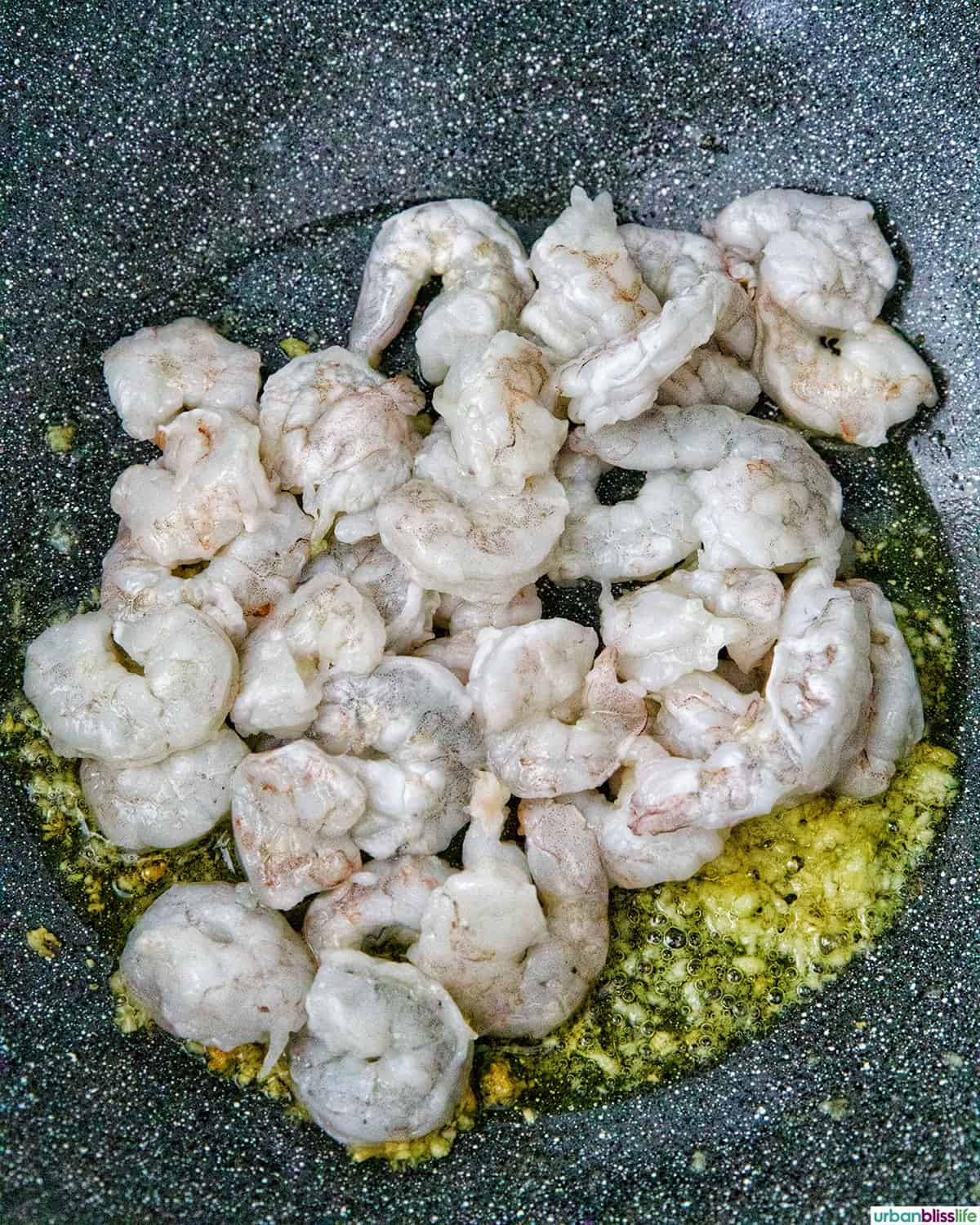 shrimp cooking in a wok.