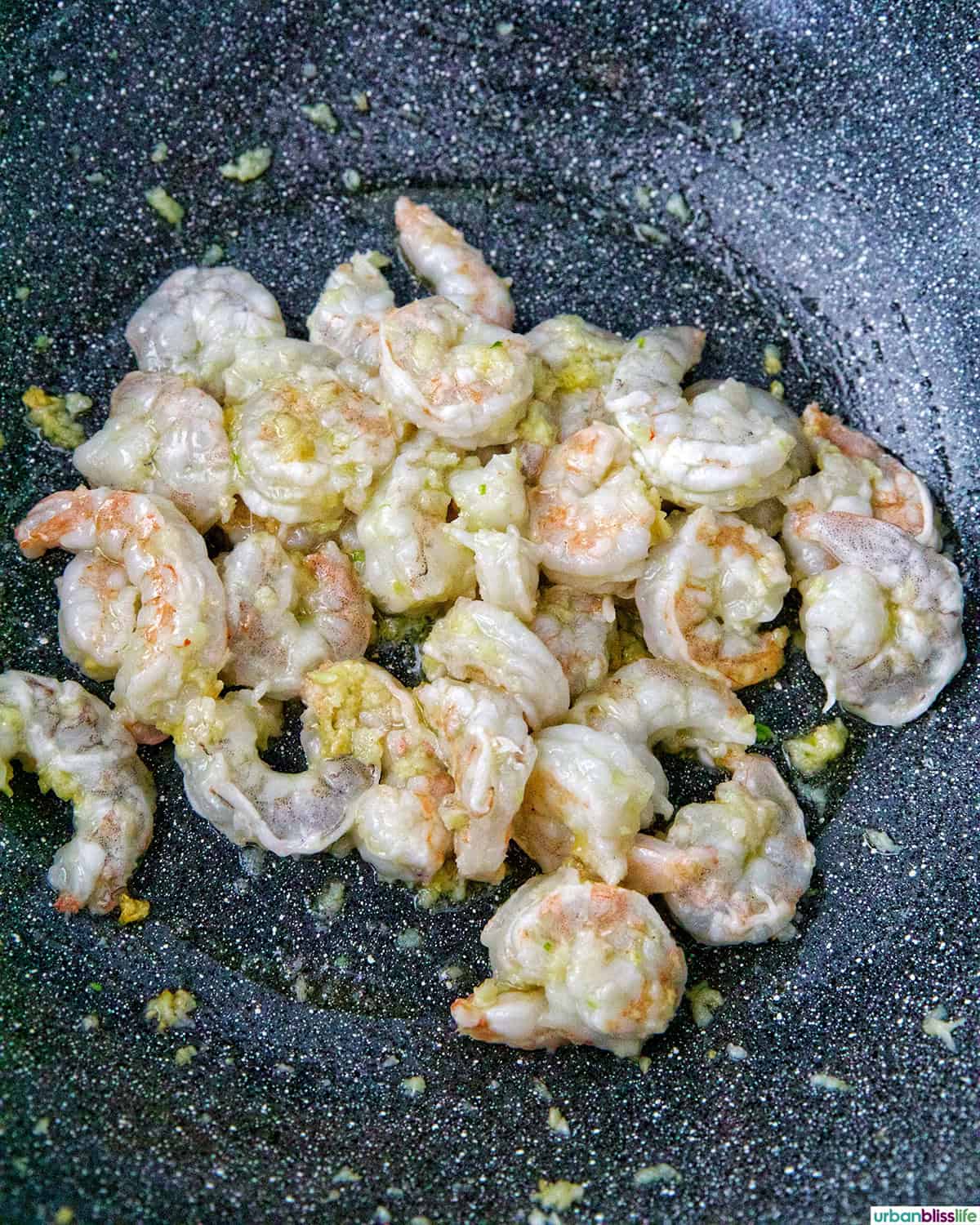 shrimp cooking in a wok.