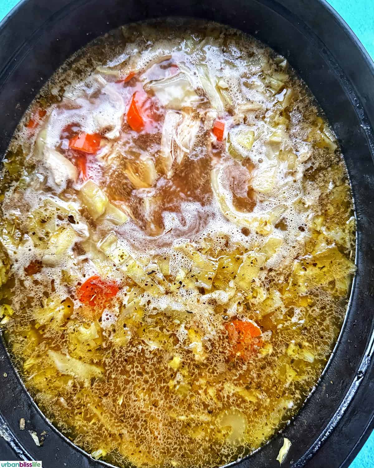 chicken cabbage soup cooking in a dutch oven..