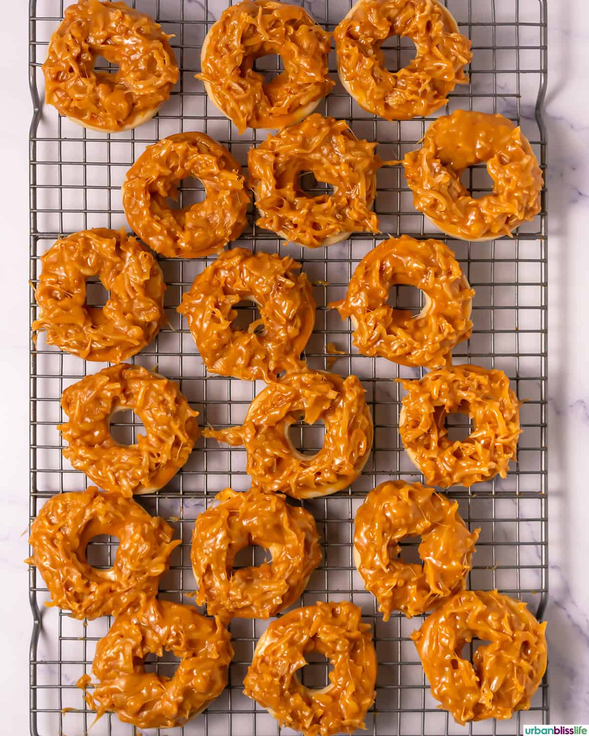 coconut Samoa cookies without chocolate on a cooling rack.
