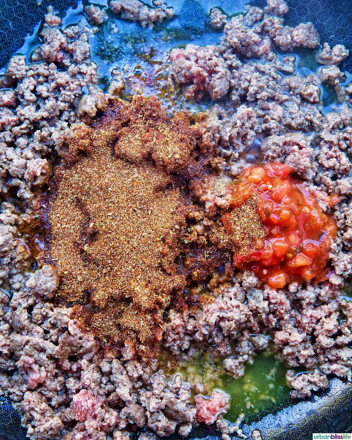 taco seasoning and salsa added to ground beef.