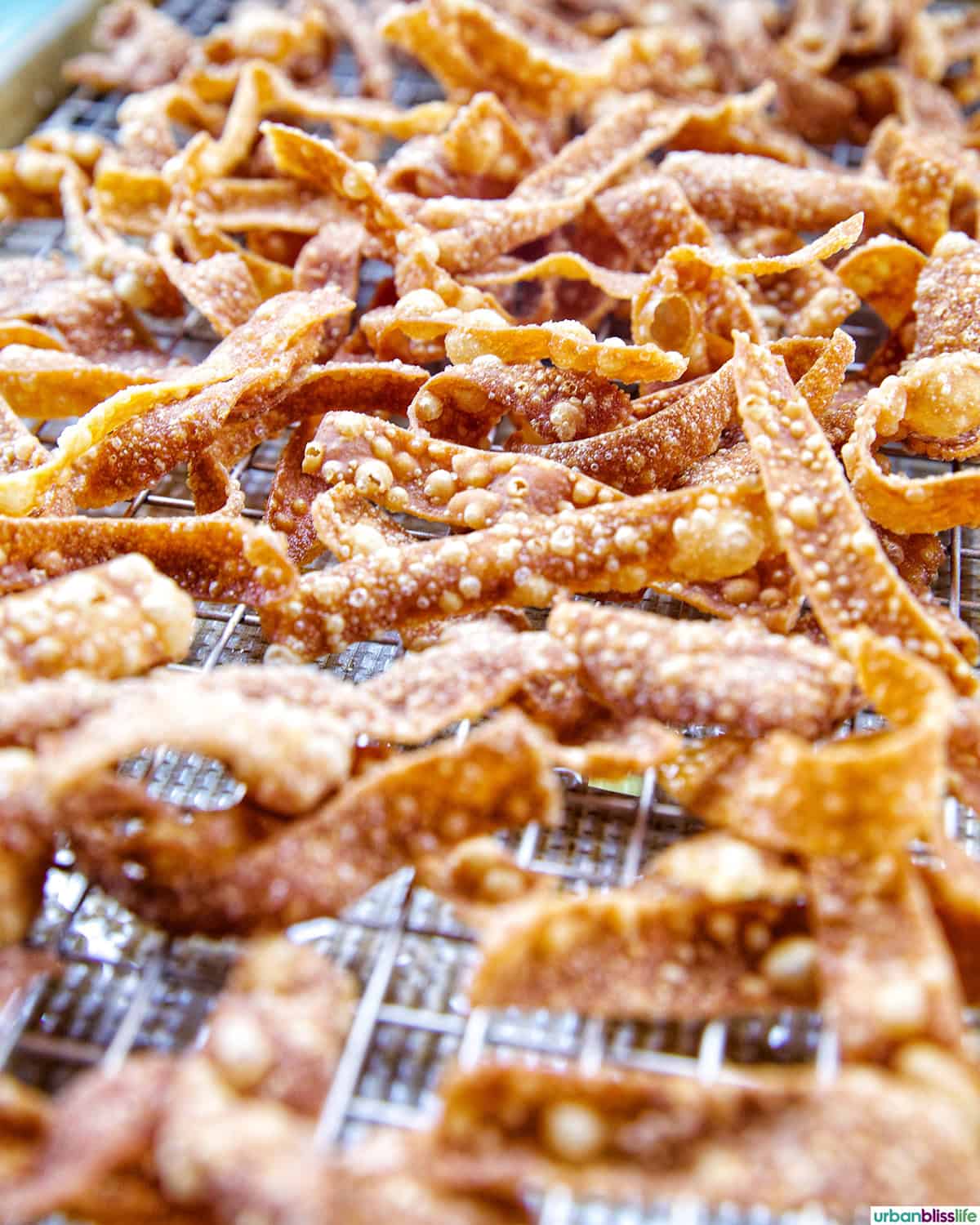 Fried Wonton Strips on a wire rack.