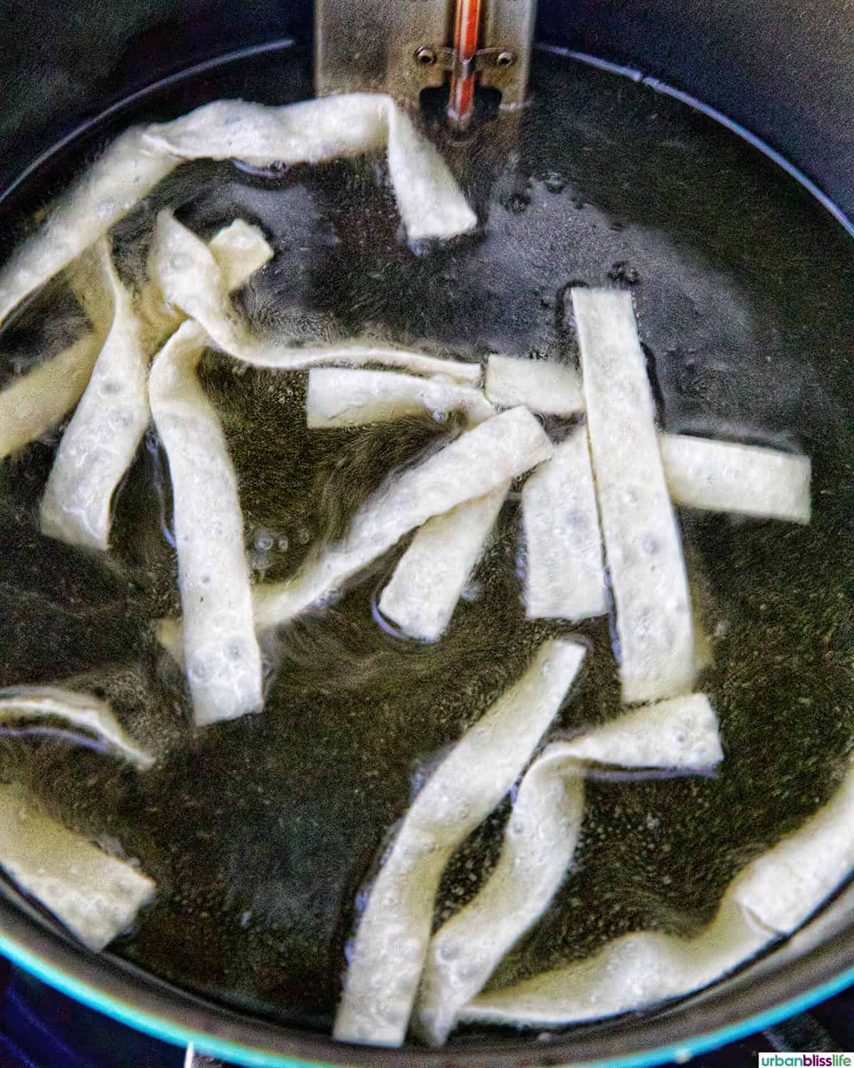 Fried Wonton Strips cooking in hot oil.