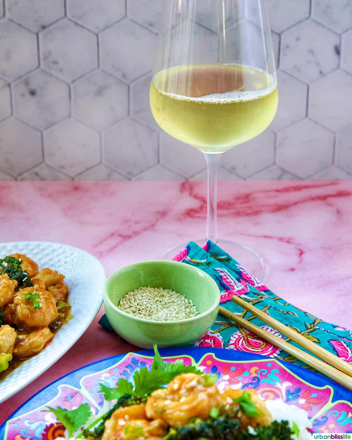 shrimp and broccoli str fry with a glass of white wine.