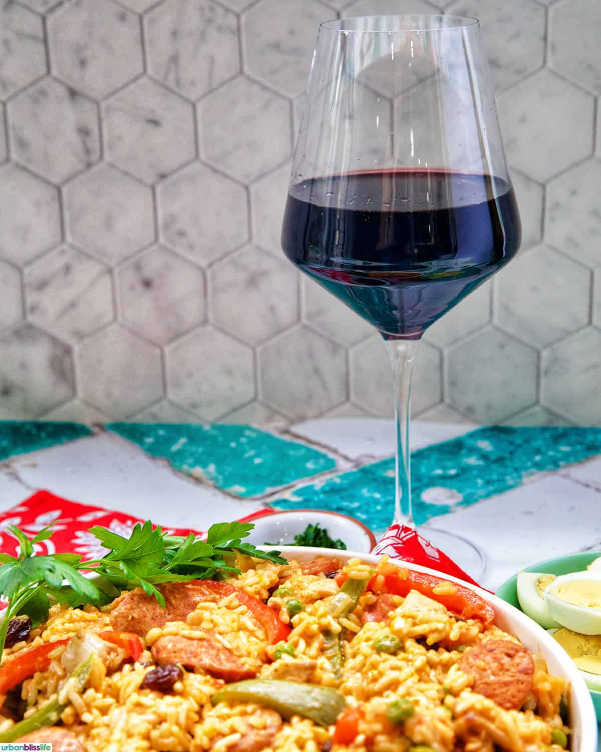 Arroz a la Valenciana with glass of red wine.