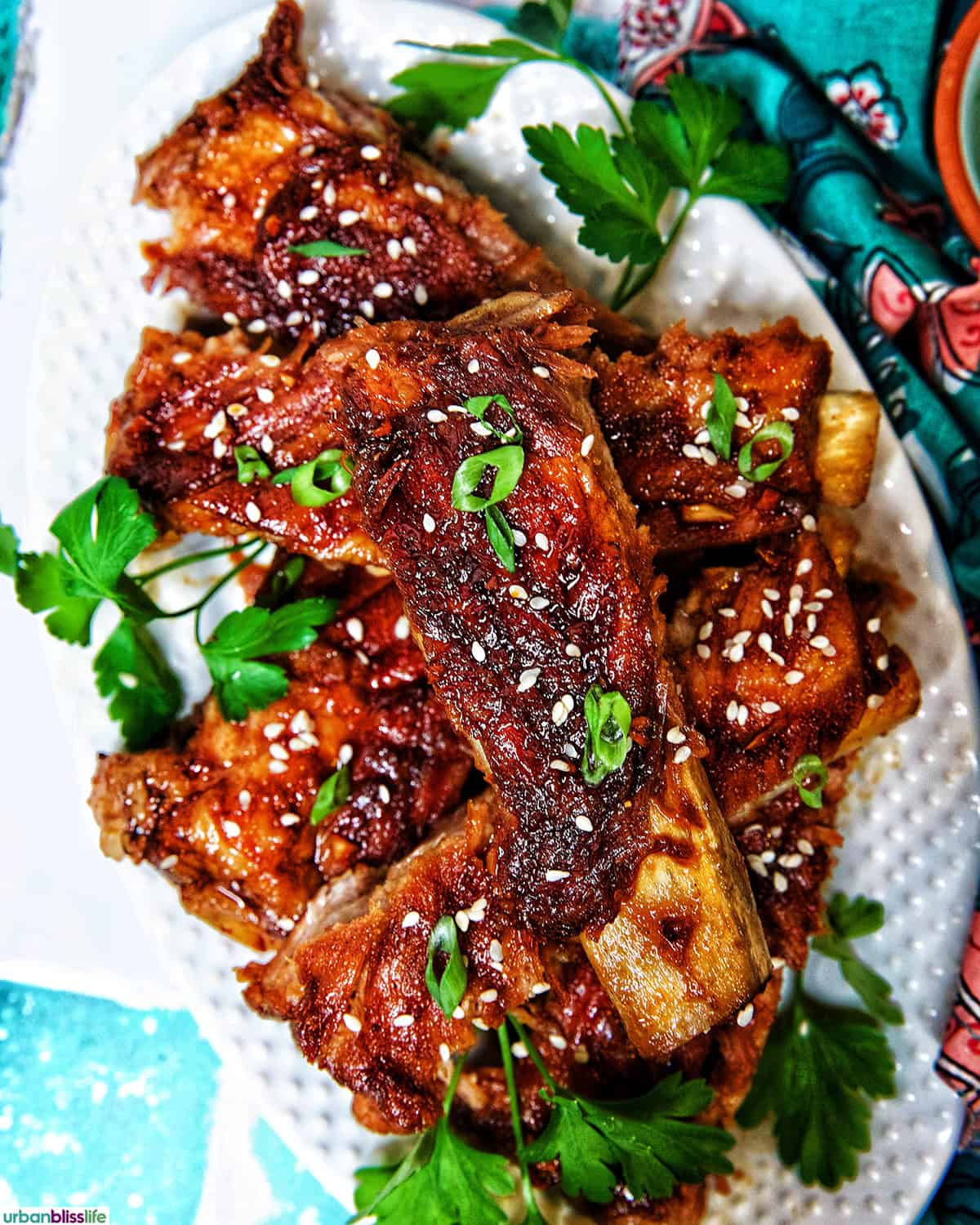 Instant Pot Asian Sticky Pork Ribs on a white plate.