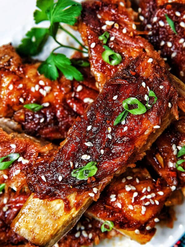 Instant Pot Asian Sticky Pork Ribs on a white plate.
