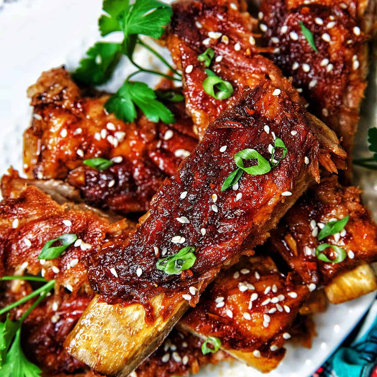 Instant Pot Asian Sticky Pork Ribs on a white plate.