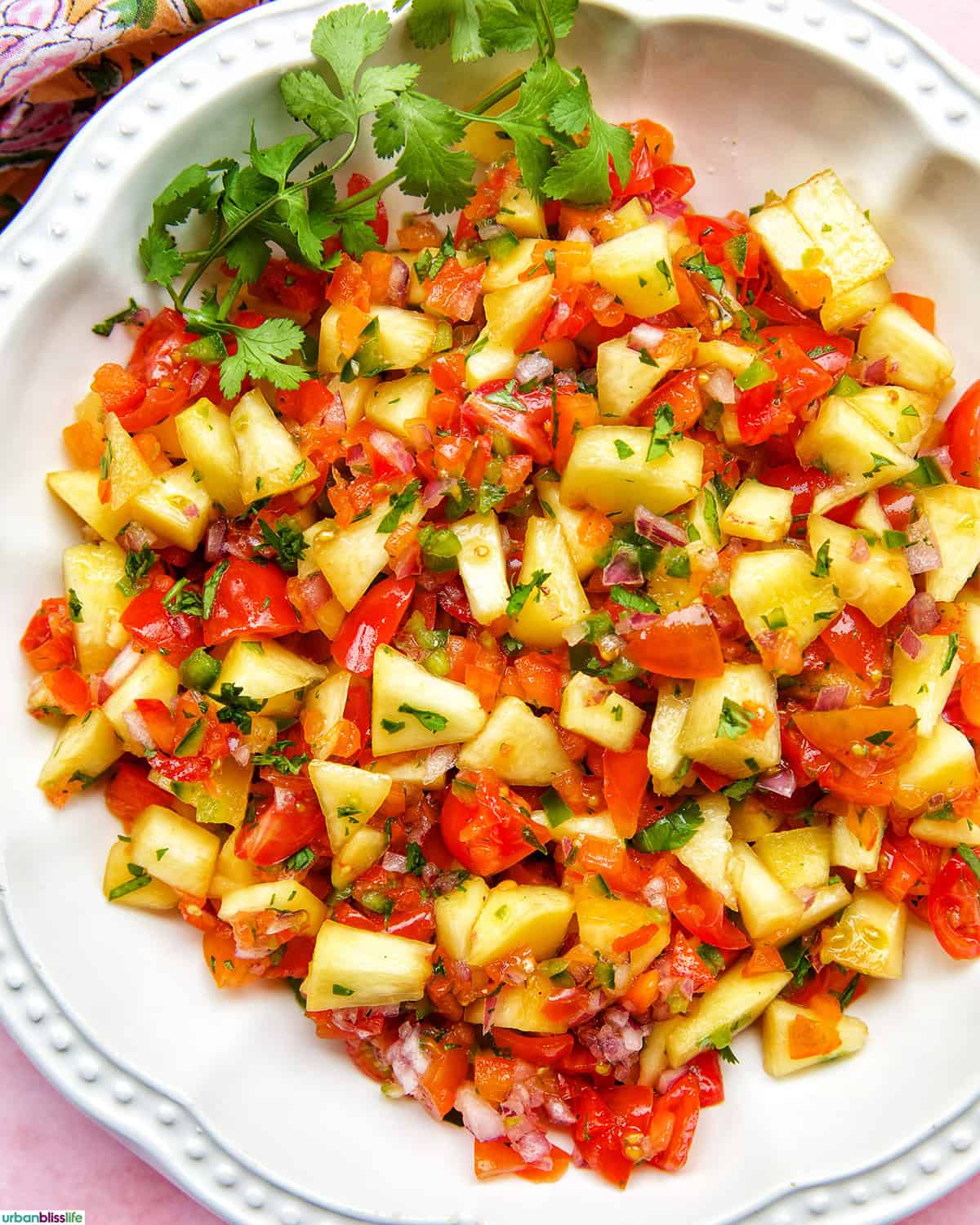 peach salsa with tomatoes, cilantro.