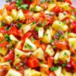 peach salsa with tomatoes, cilantro.