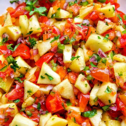 peach salsa with tomatoes, cilantro.