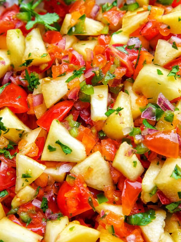 peach salsa with tomatoes, cilantro.