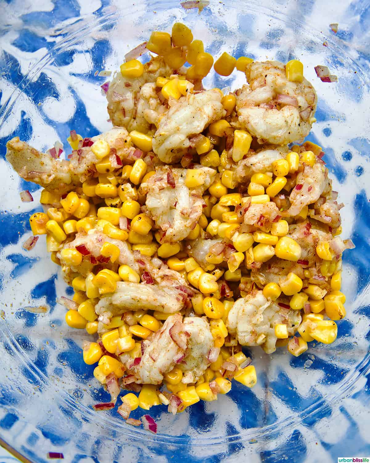 bowl of ingredients to make shrimp corn salad.