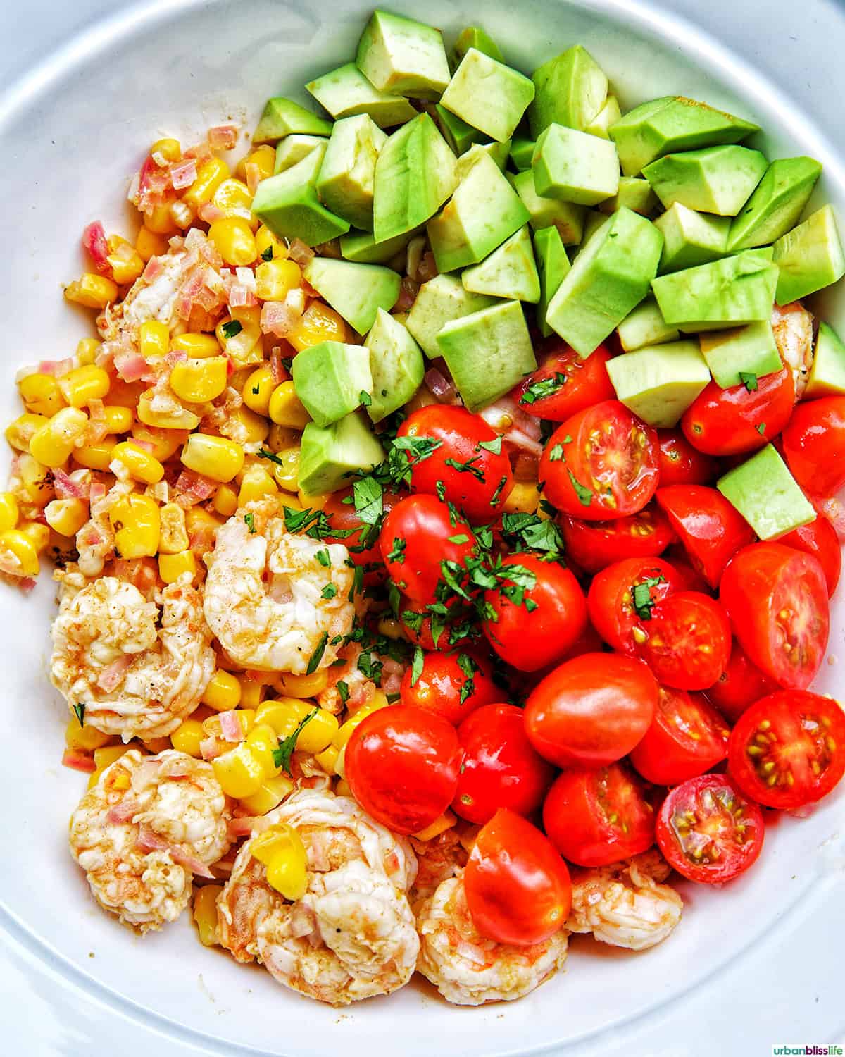 bowl of ingredients to make shrimp corn salad.
