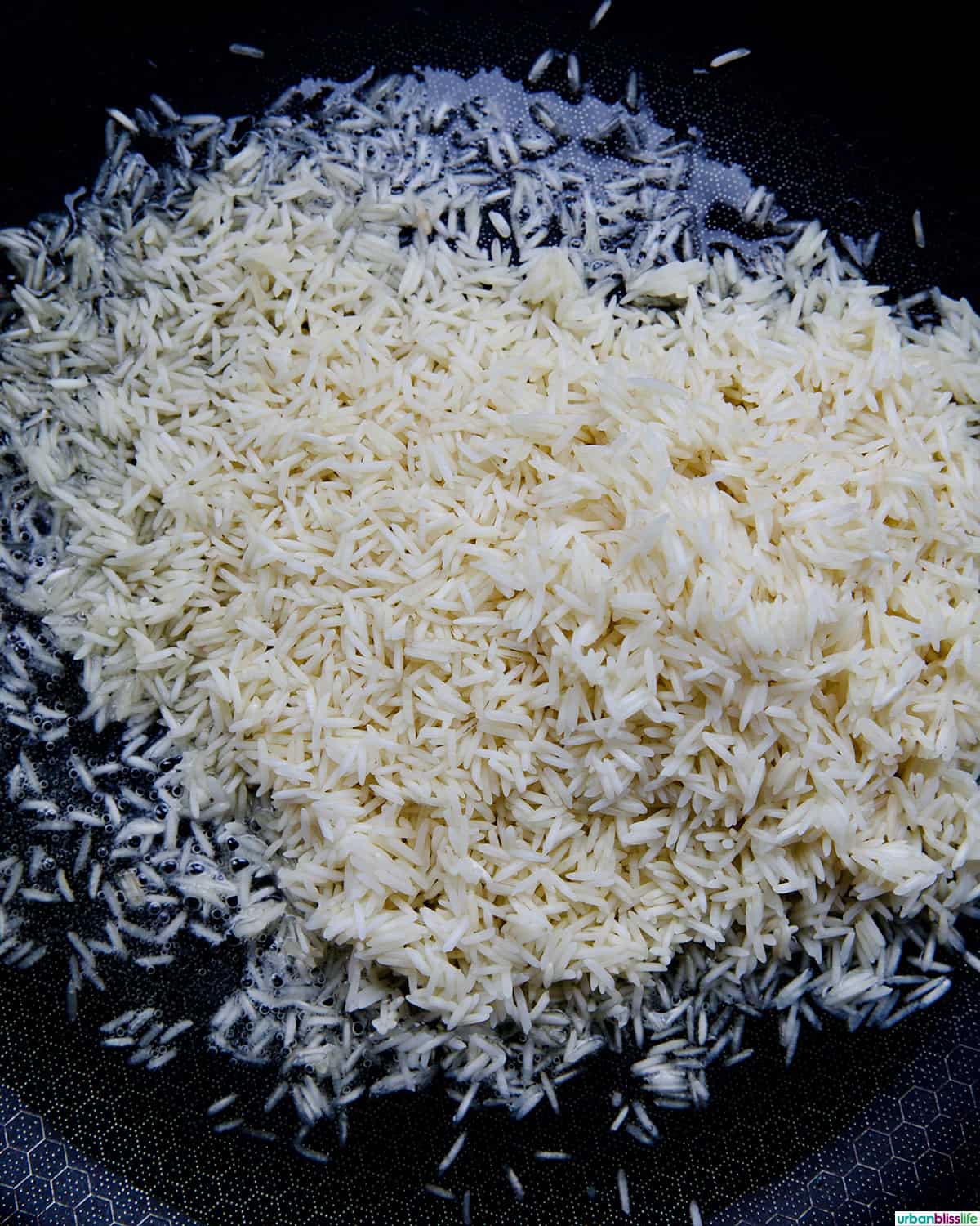 rice toasting in a skillet.