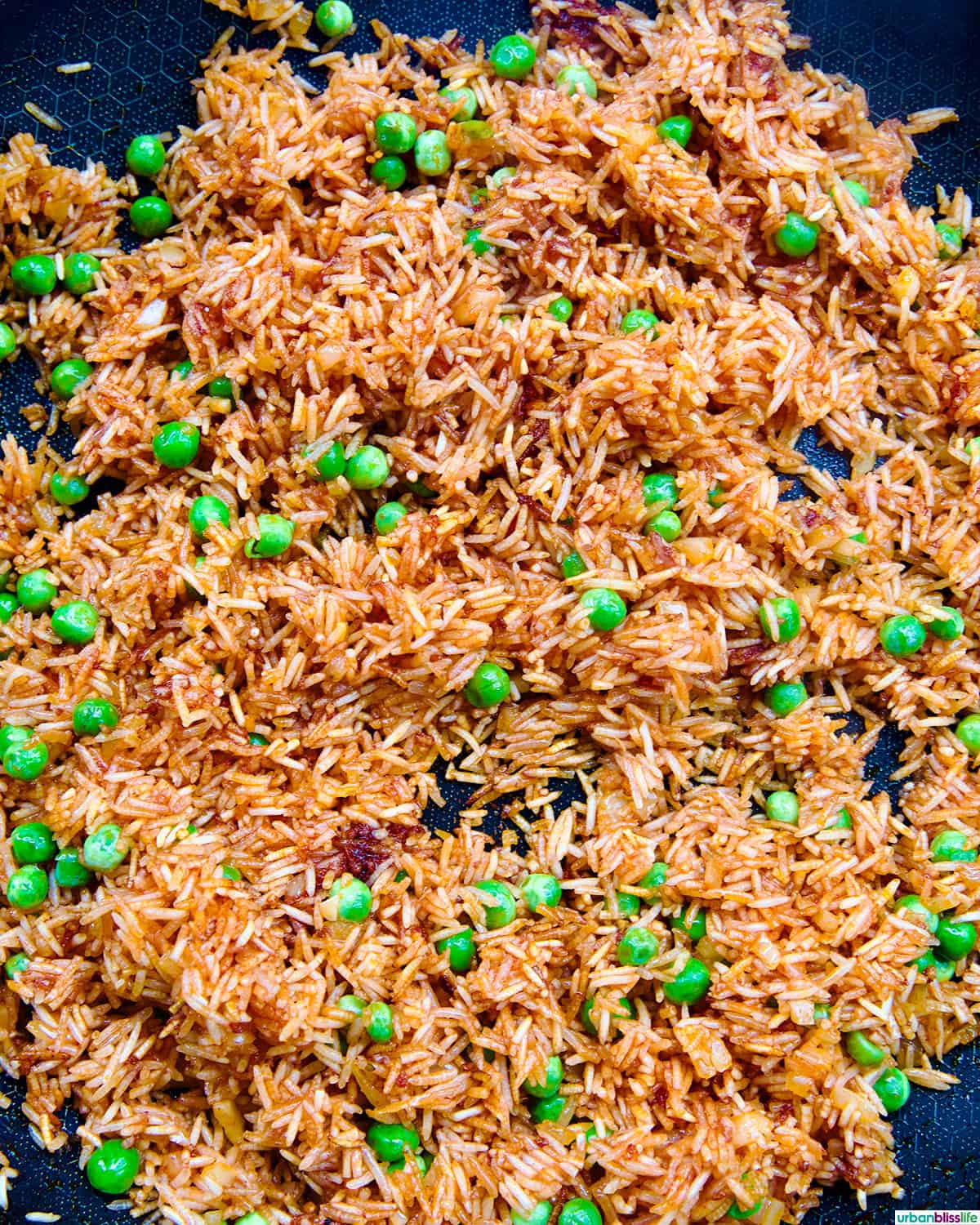 vegetarian Mexican rice and peas in a skillet.