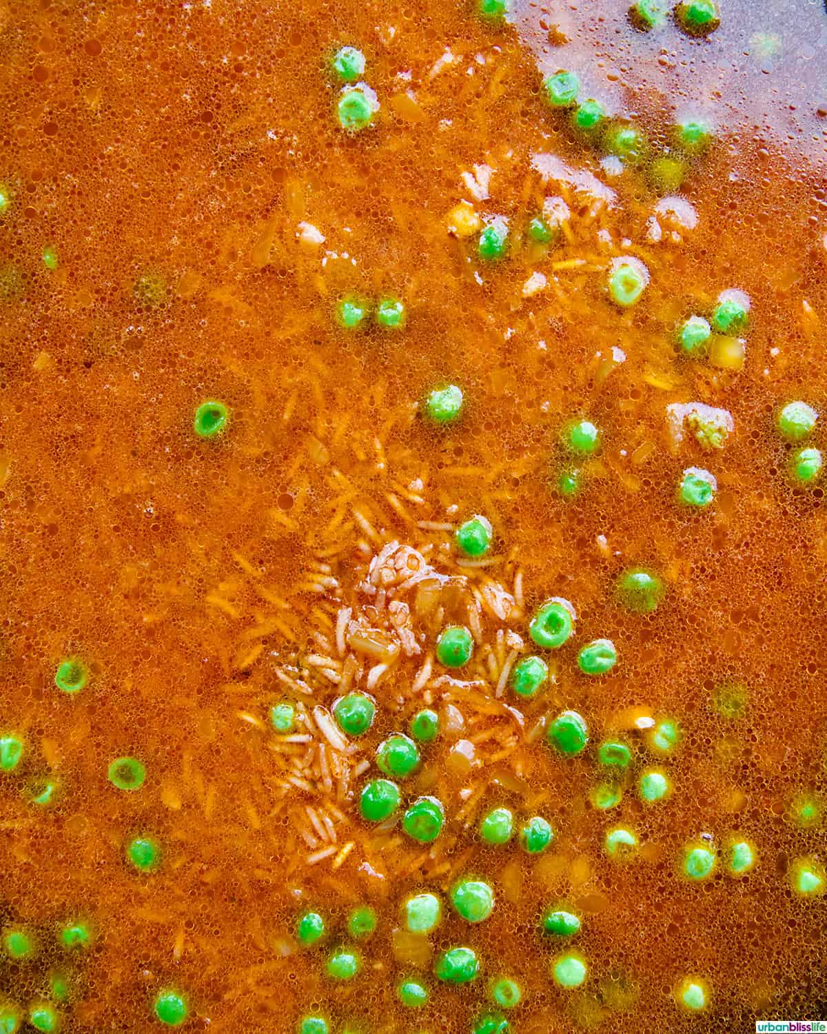 vegetarian Mexican rice and peas in a skillet.
