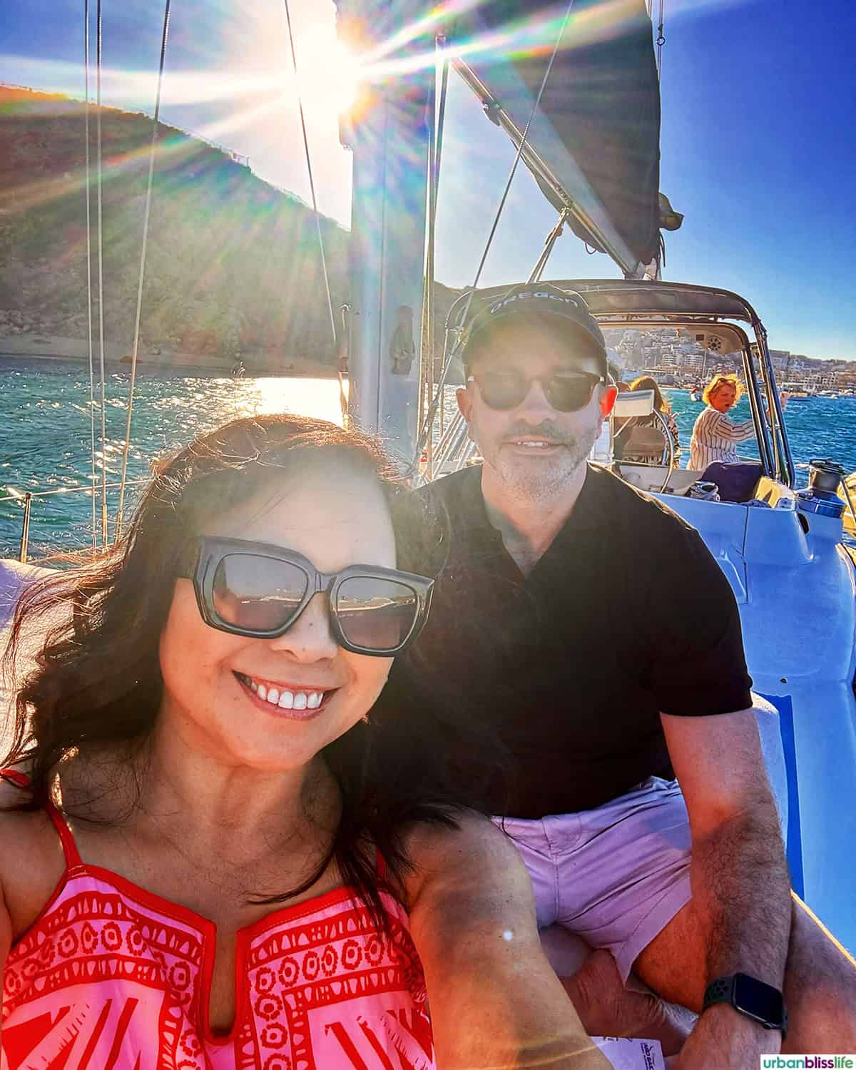 marlynn and alain in sailboat in cabo
