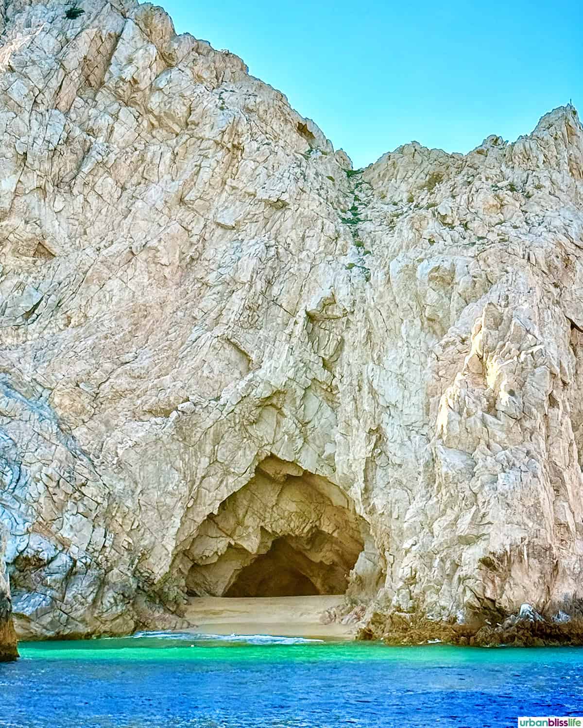 caves and beach seen from a sunset sail cruise in Cabo San Lucas, Mexico.