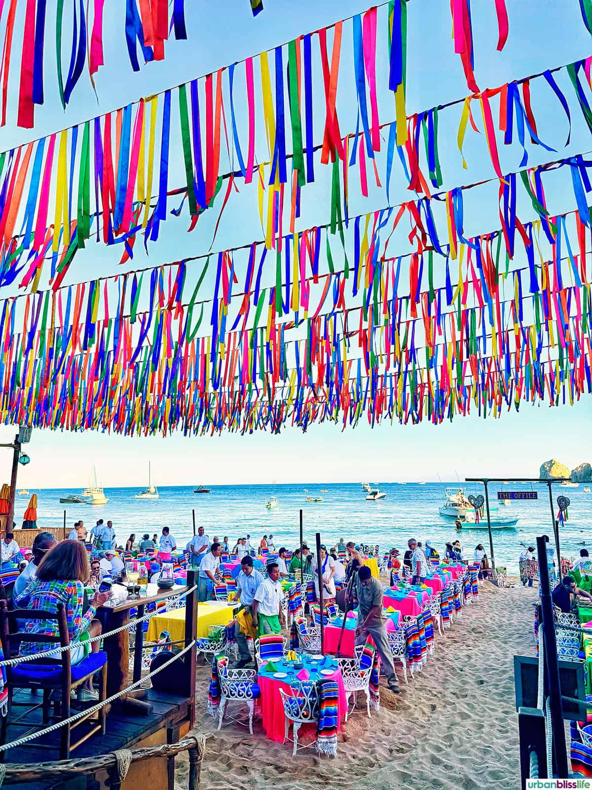 Colorful beachfront dining at The Office beac bar in Cabo San Lucas, Mexico.