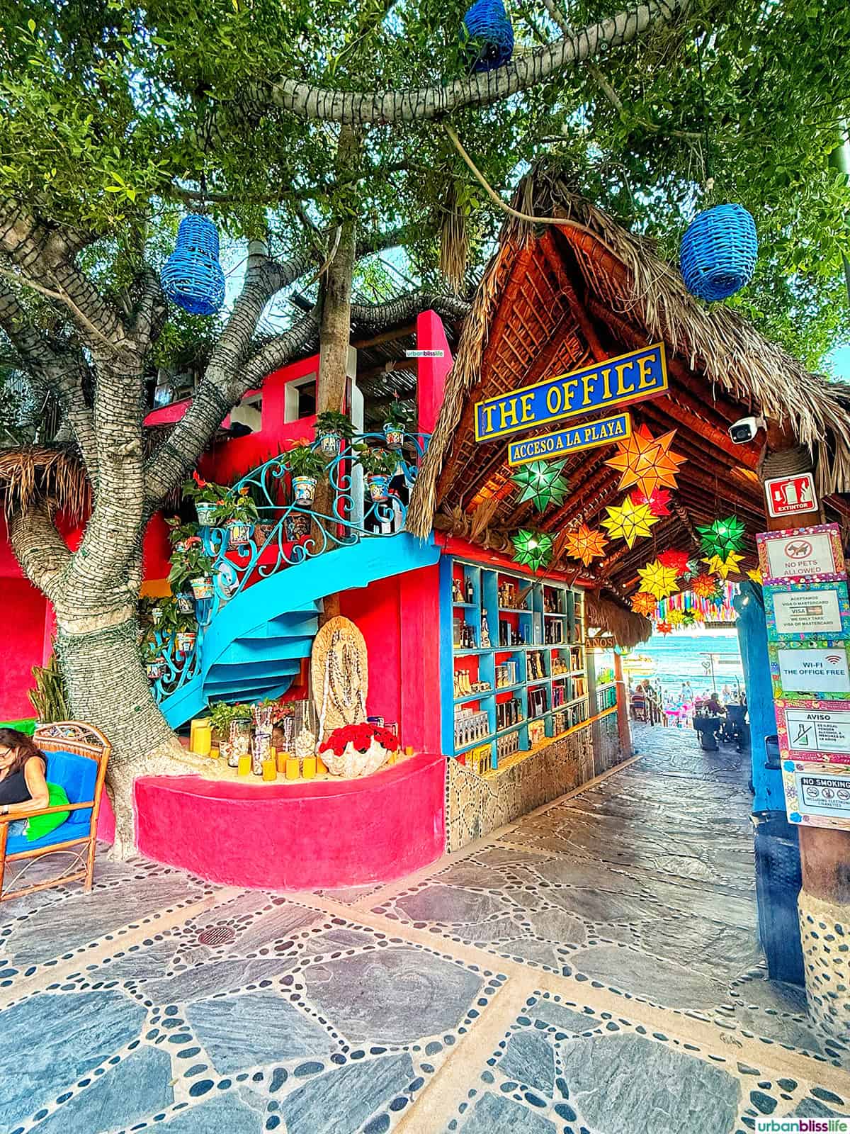 colorful exterior of The Office beac bar in Cabo San Lucas, Mexico.