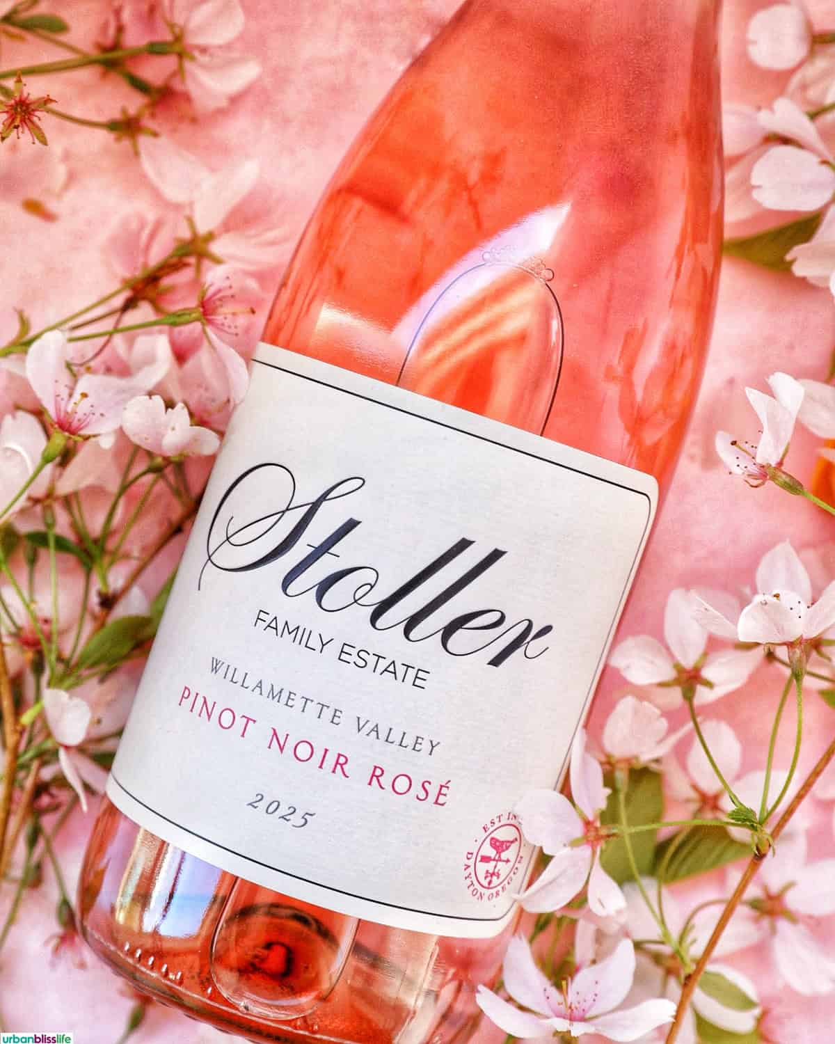 Bottle of Stoller Wine Rose of Pinot Noir wine with cherry blossoms.