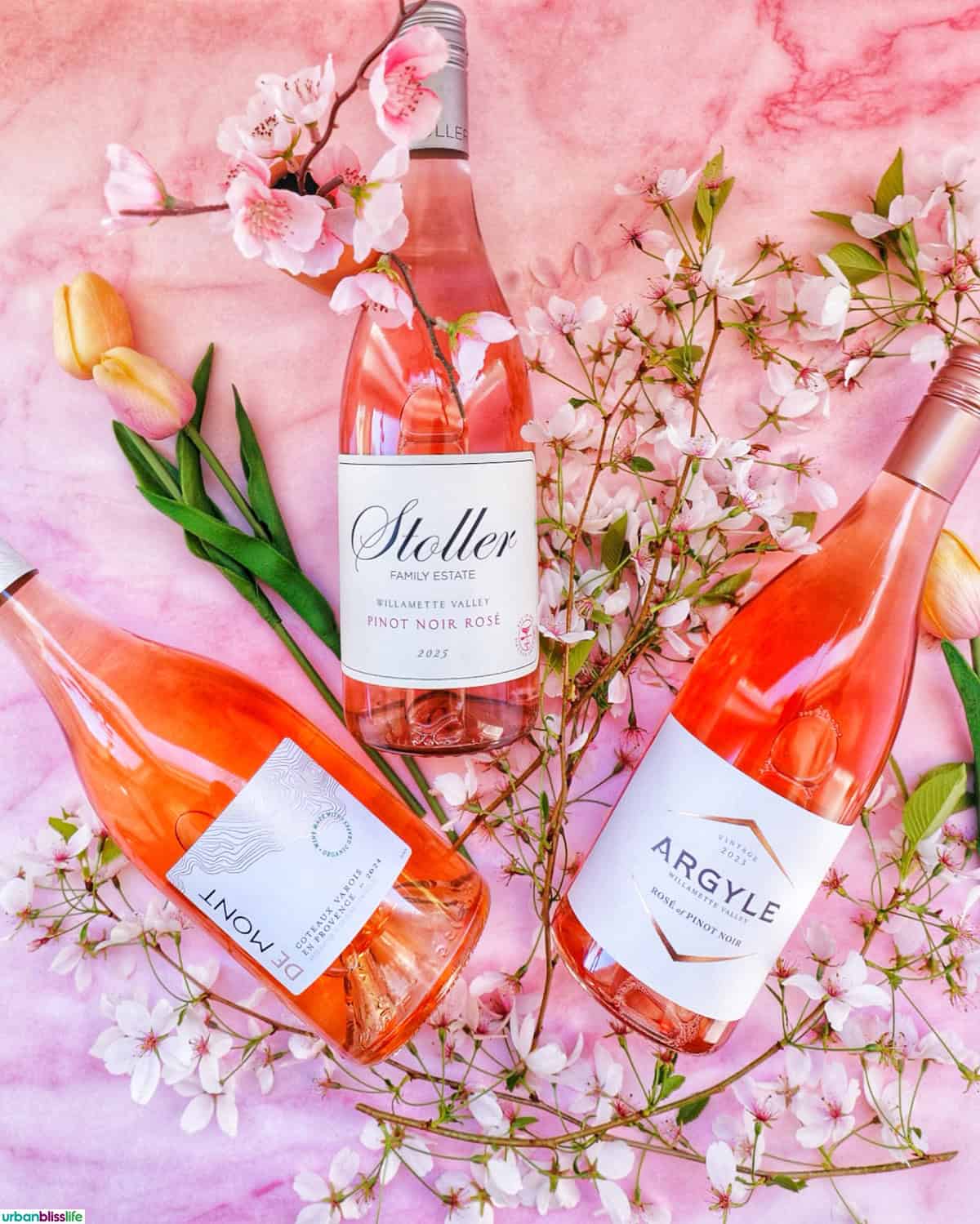 three bottles of rosé wines at Trader Joe's with cherry blossoms.