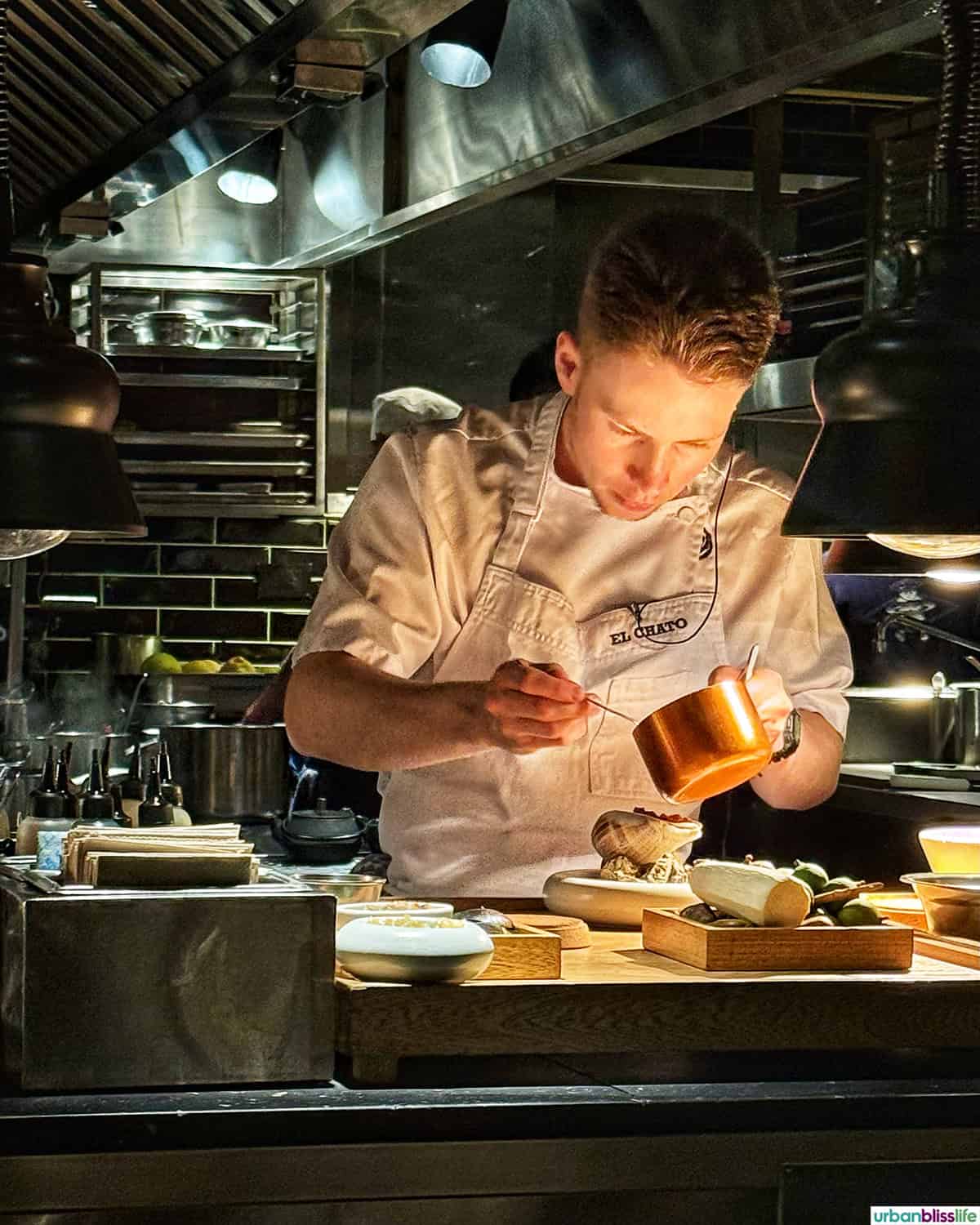 chef plating at El Chato restaurant in Bogota, Colombia.