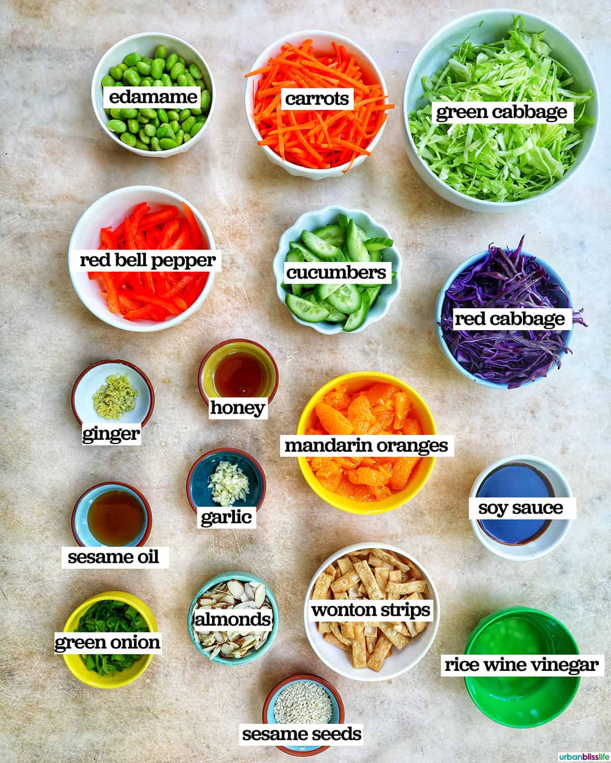 bowls of ingredients to make Asian crunch salad.