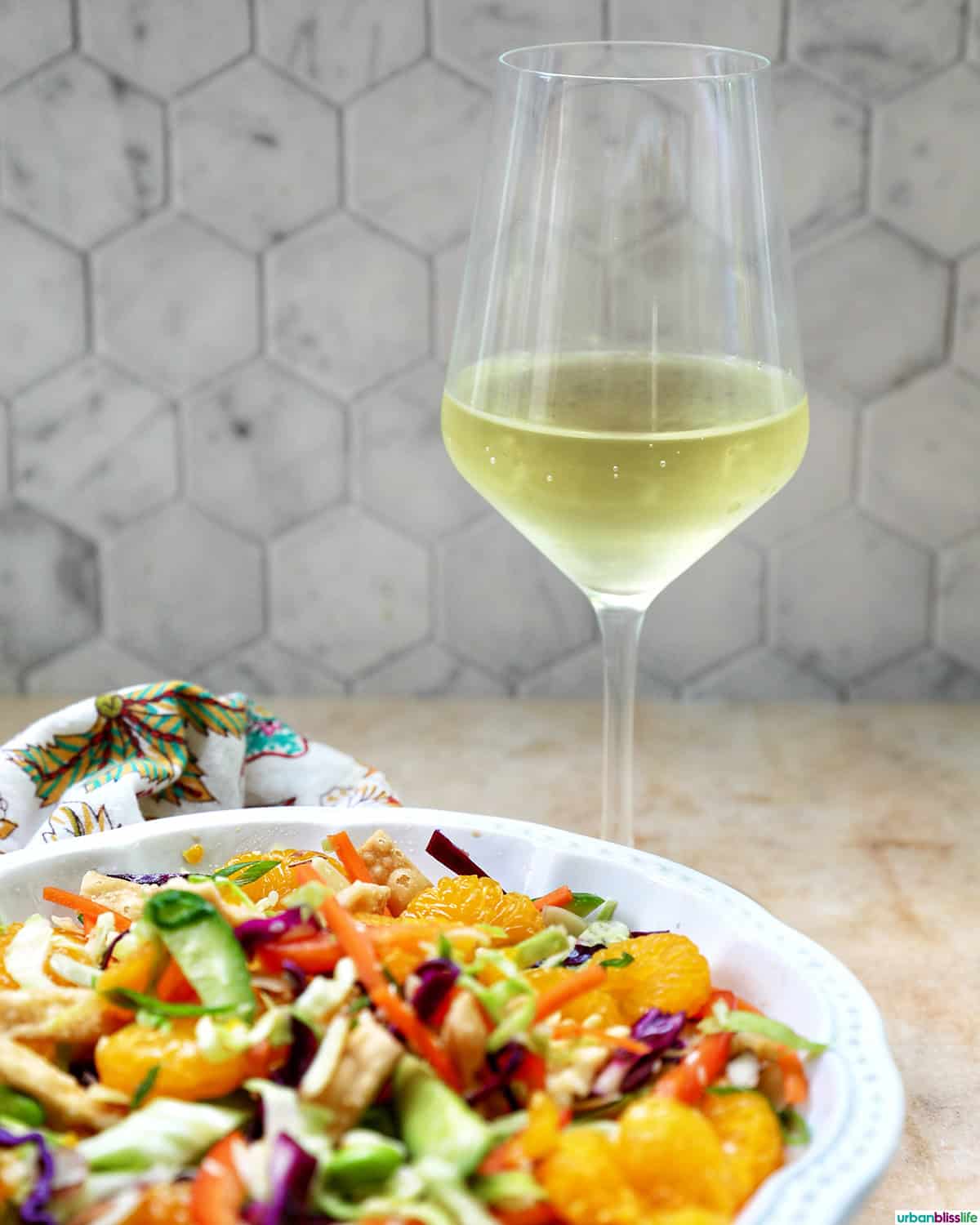 Asian crunch salad with a glass of white wine.