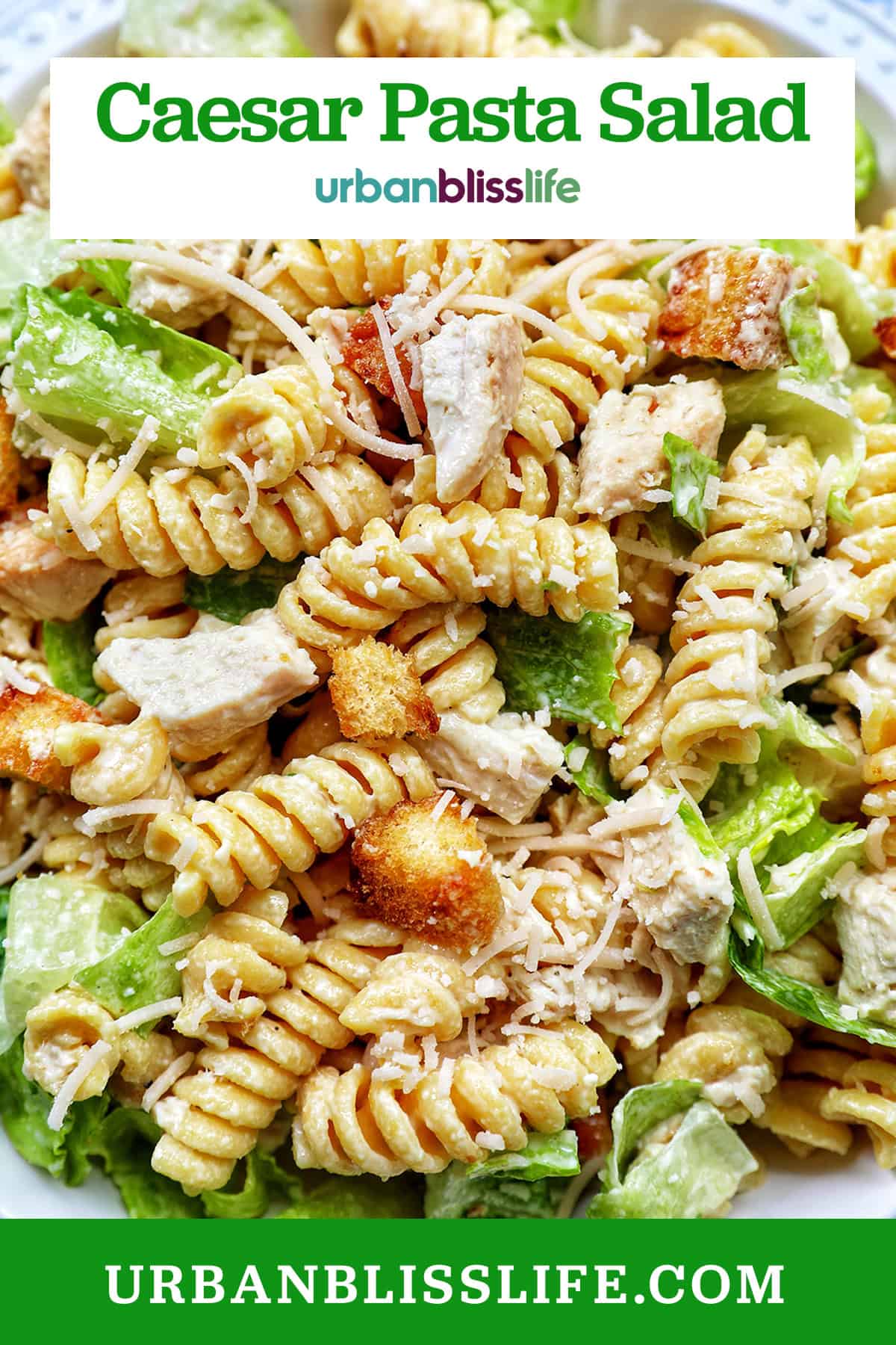 bowl of Caesar pasta salad with title text overlay.